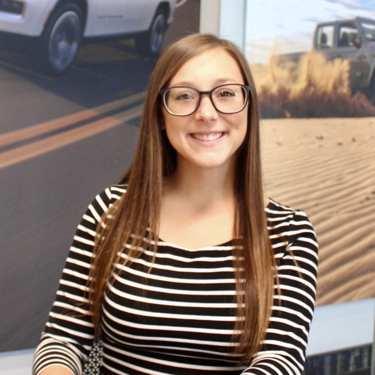 Cassidy smiling at the dealership